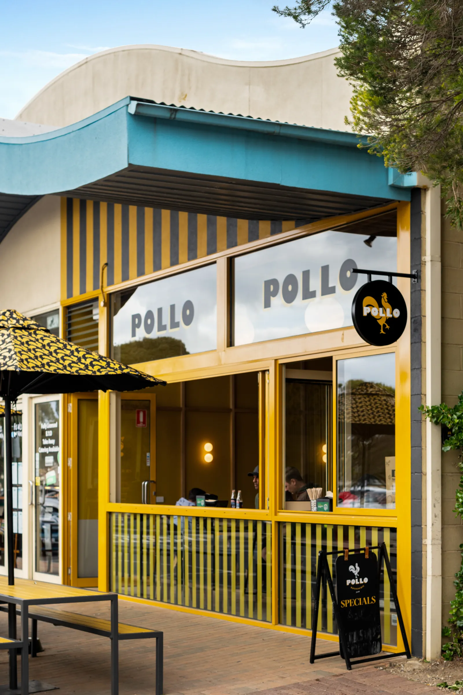 Striped shopfront of Pollo restaurant on Bristol Road, Torquay