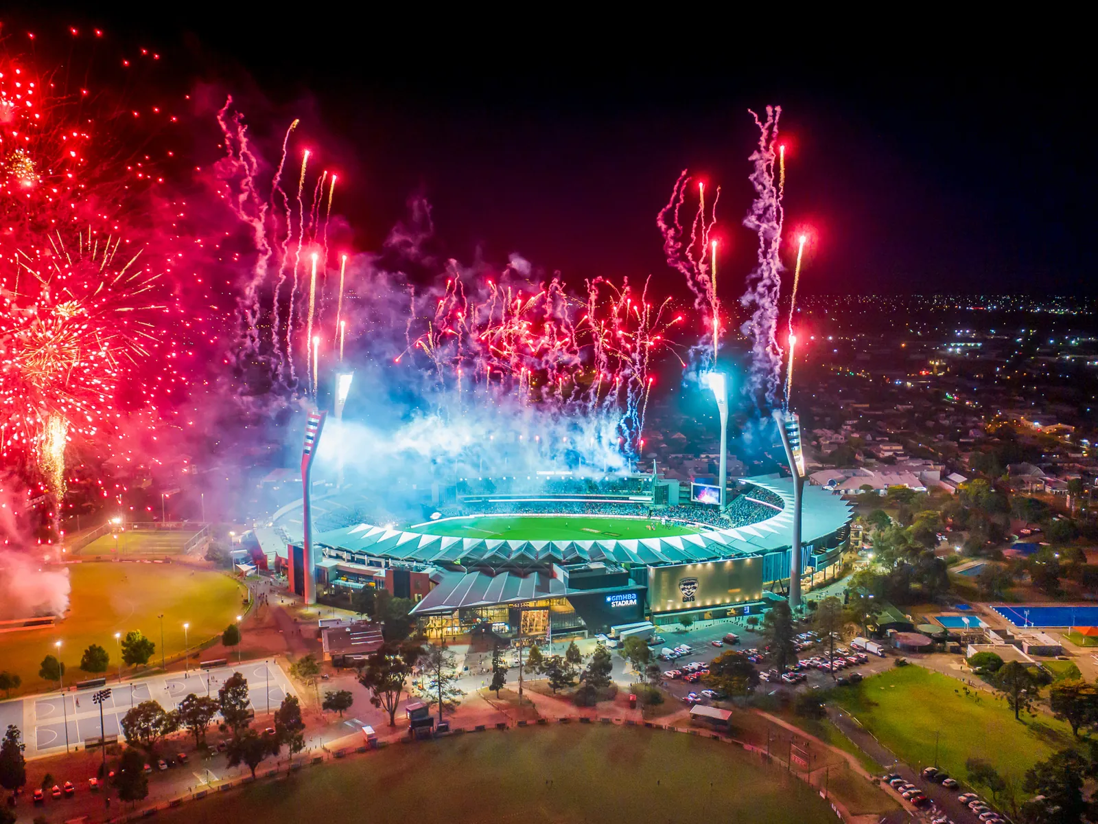 Aerial photo of fireworks over GMHBA Stadium at night, Geelong
