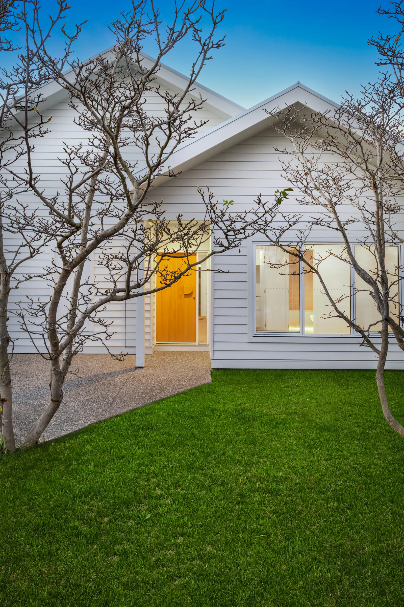 Renovated weatherboard cottage at dusk at Ann Street, Geelong West