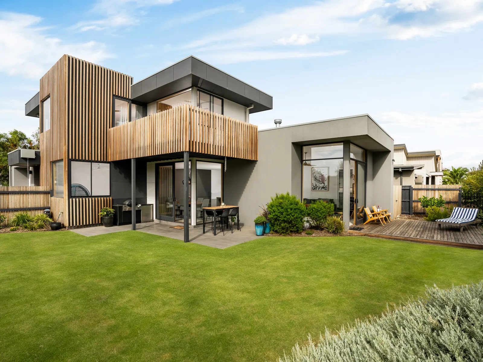 Rear elevation and yard of a timber-clad custom build at Bass Drive, Torquay