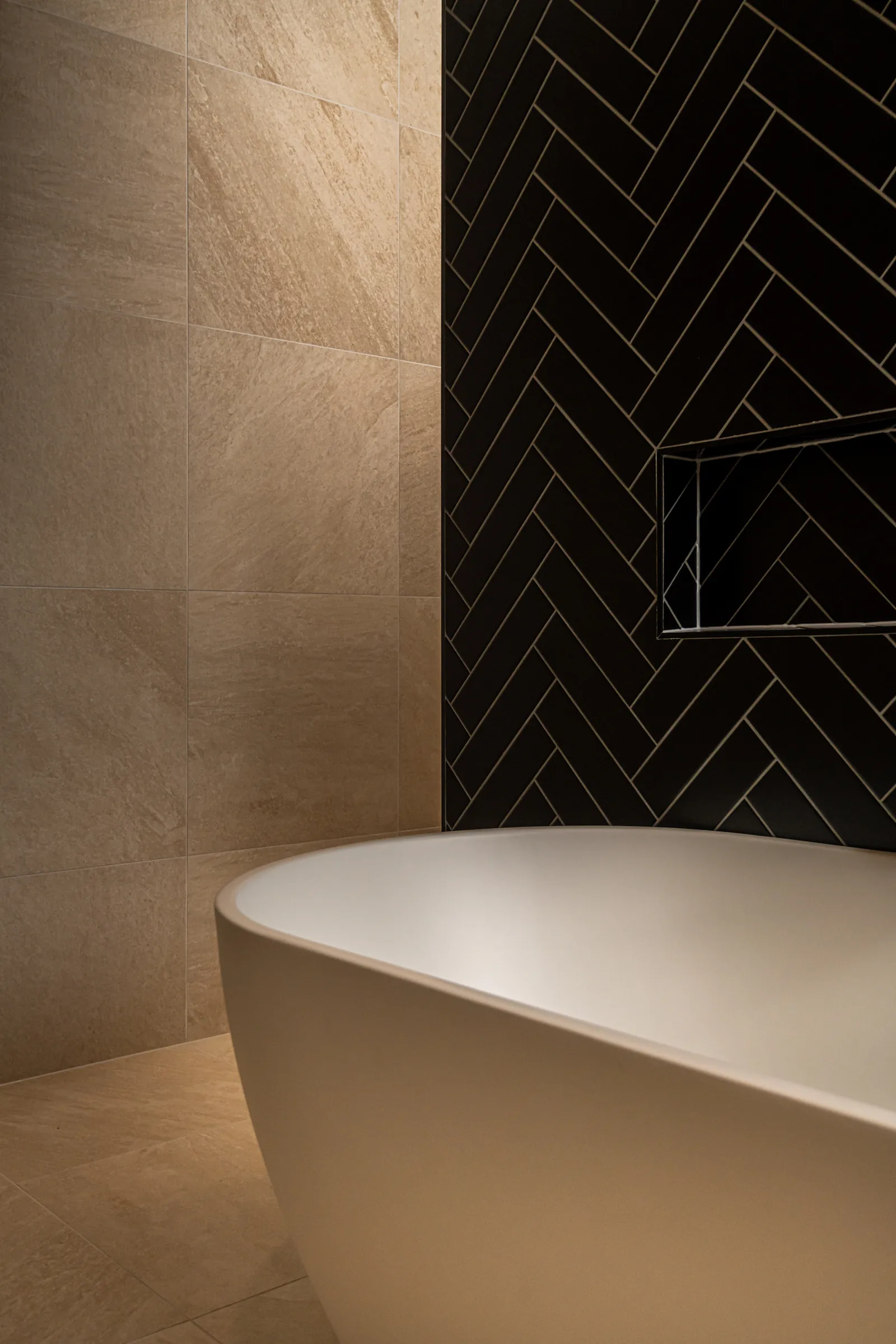Freestanding bath and dark herringbone tiles in a Fyansford ensuite