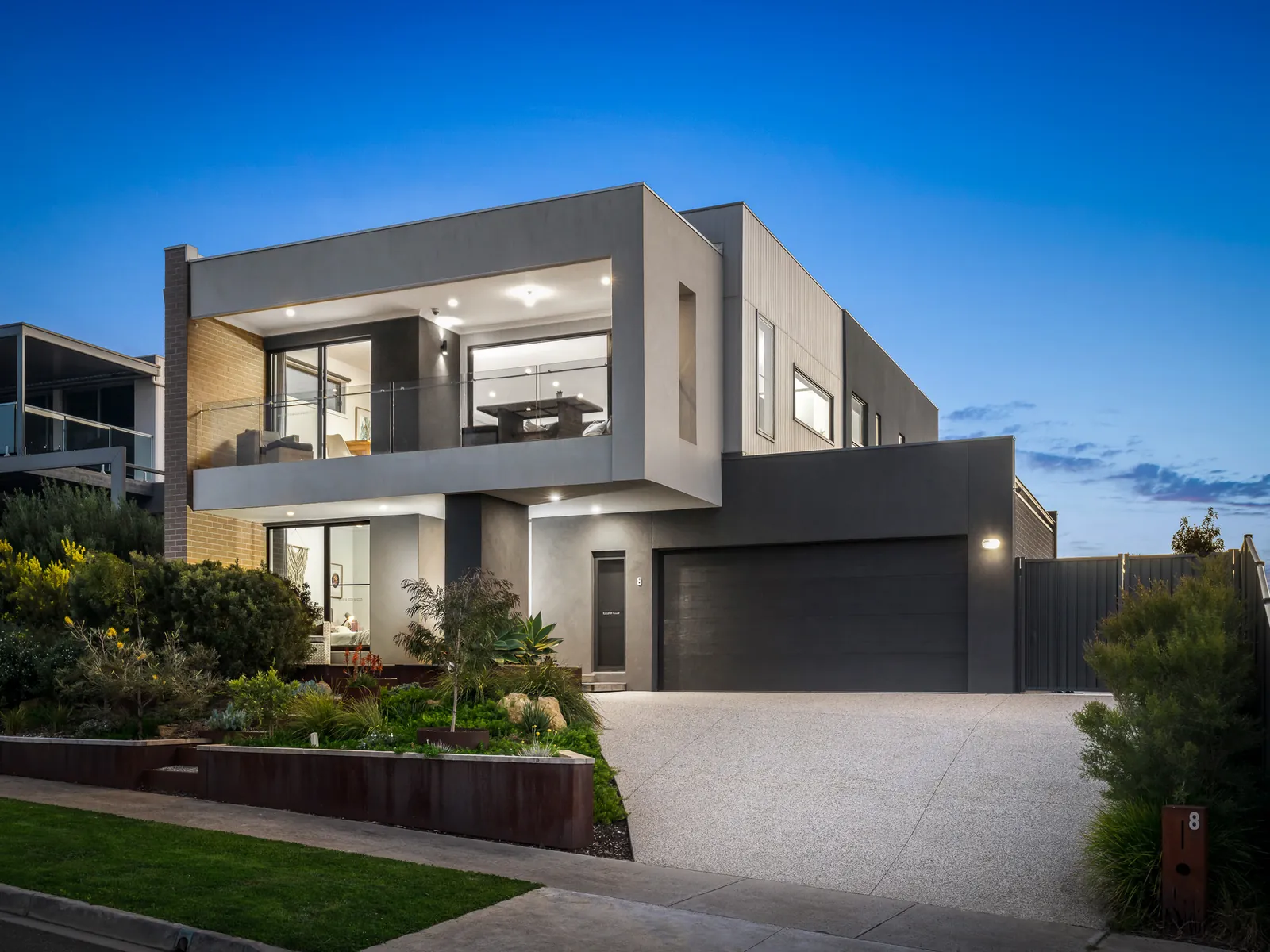 Twilight real estate photo of a modern two-storey home in Curlewis