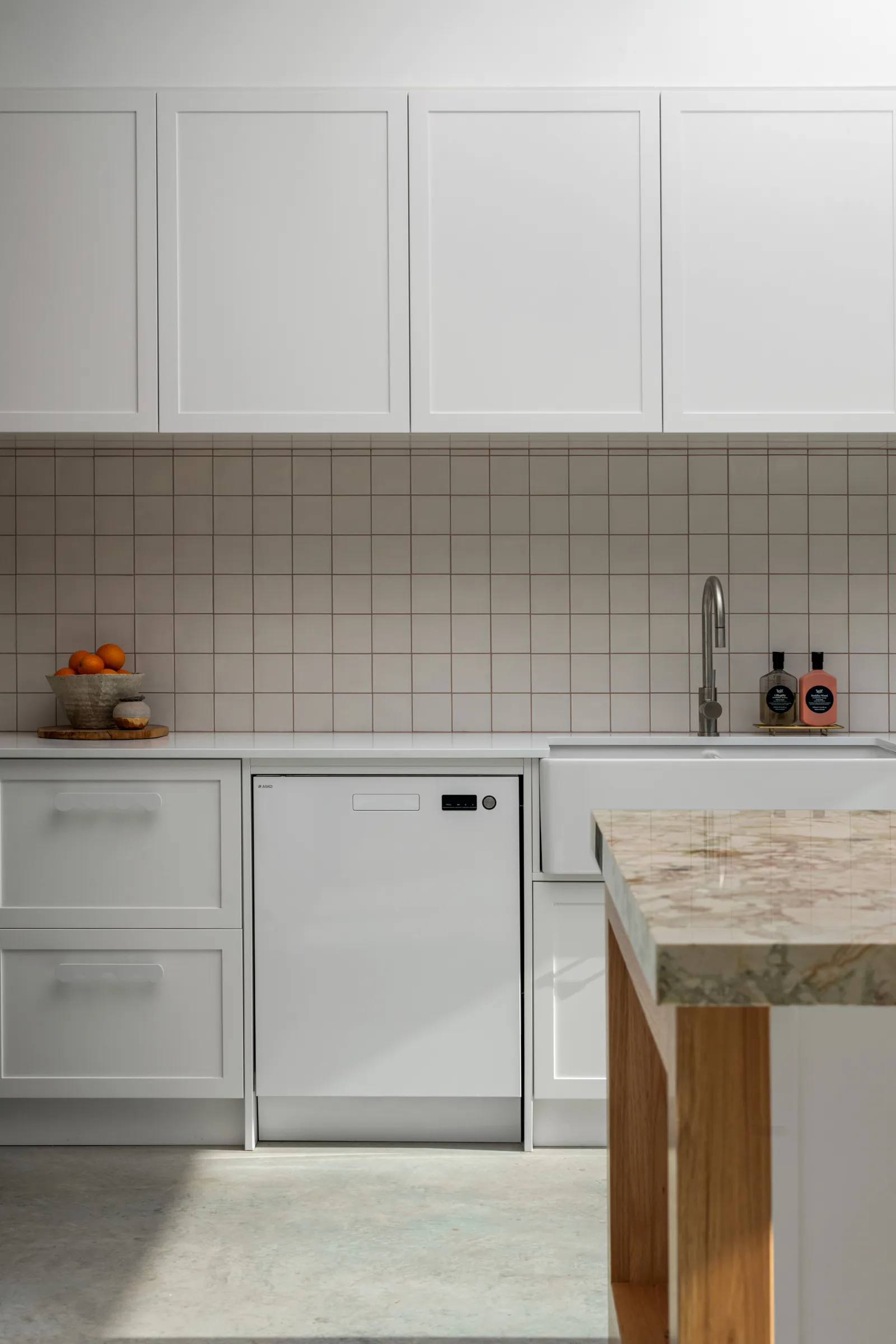 White kitchen with stone island bench and square tile splashback, Geelong West
