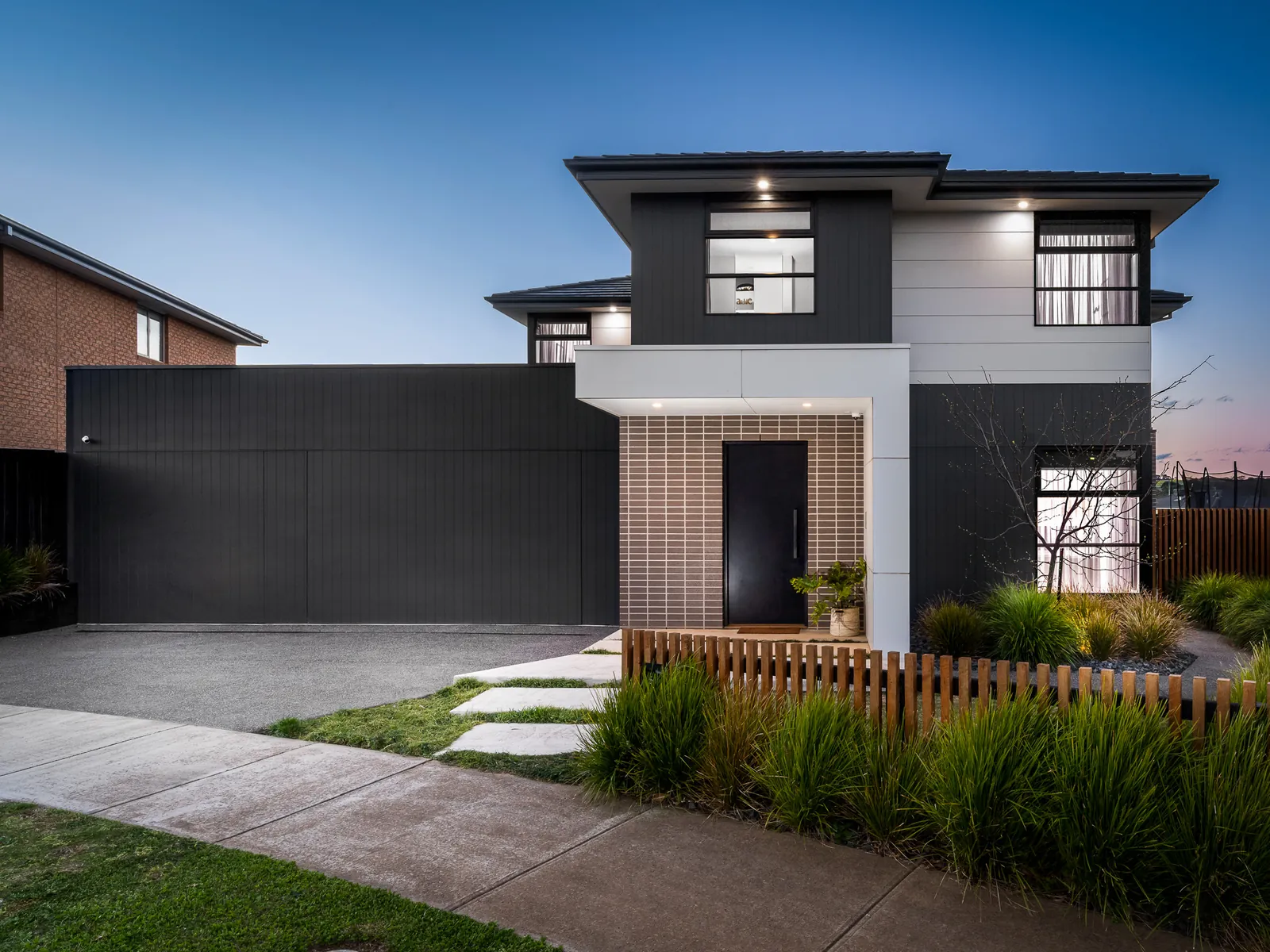 Twilight exterior of a two-storey home on Grange Park Drive, Waurn Ponds