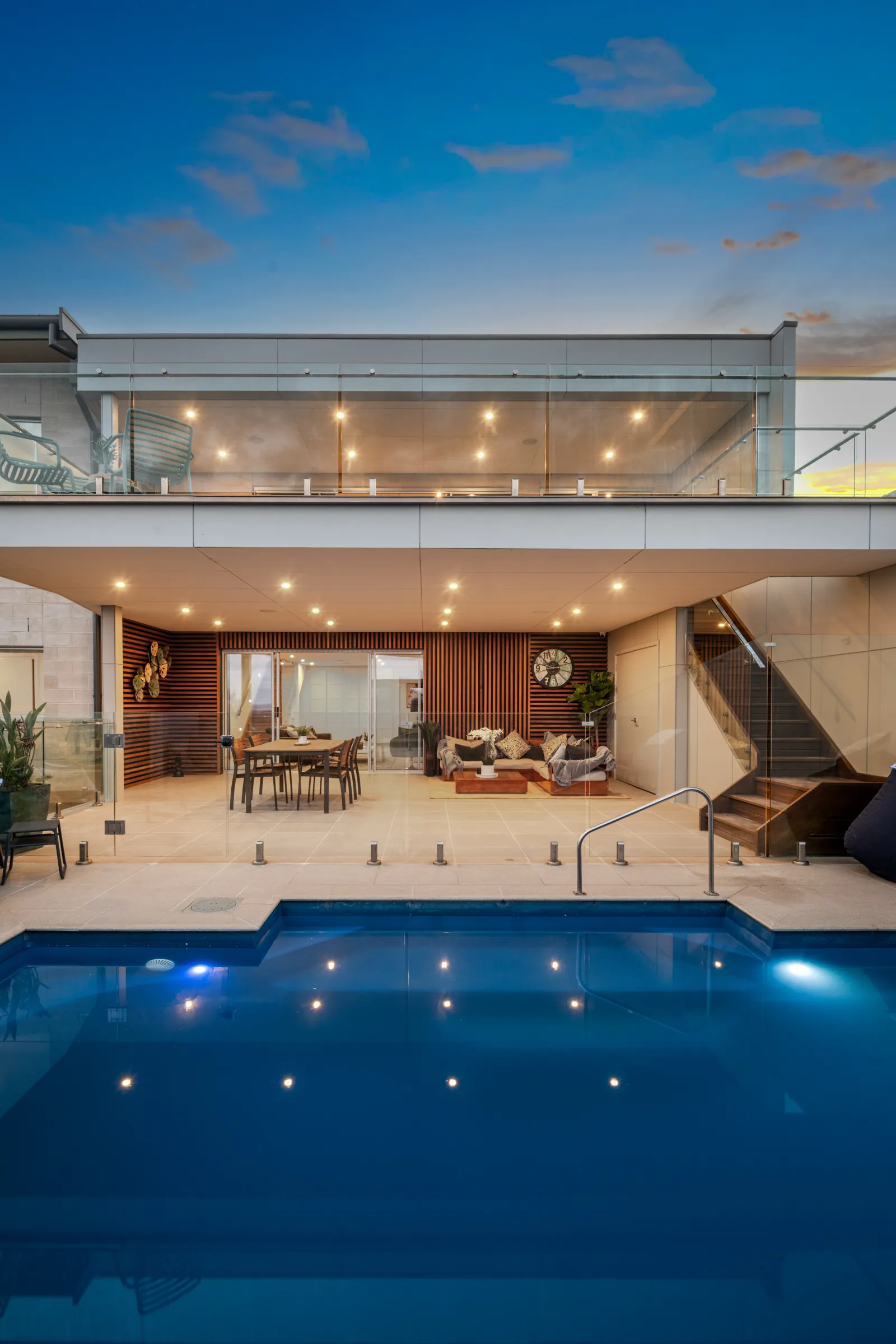Twilight photo of a pool and two-storey rear elevation, Wandana Heights