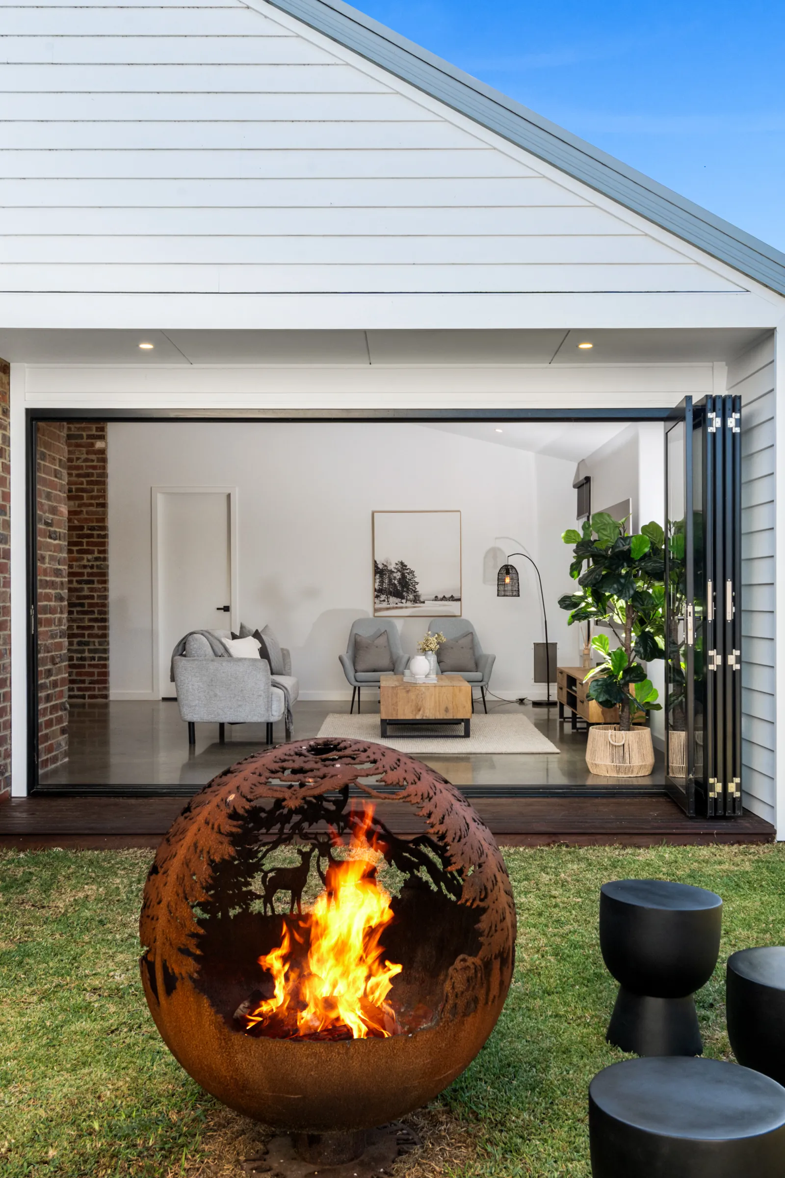 Fire pit burning in an alfresco courtyard, Armstrong Creek