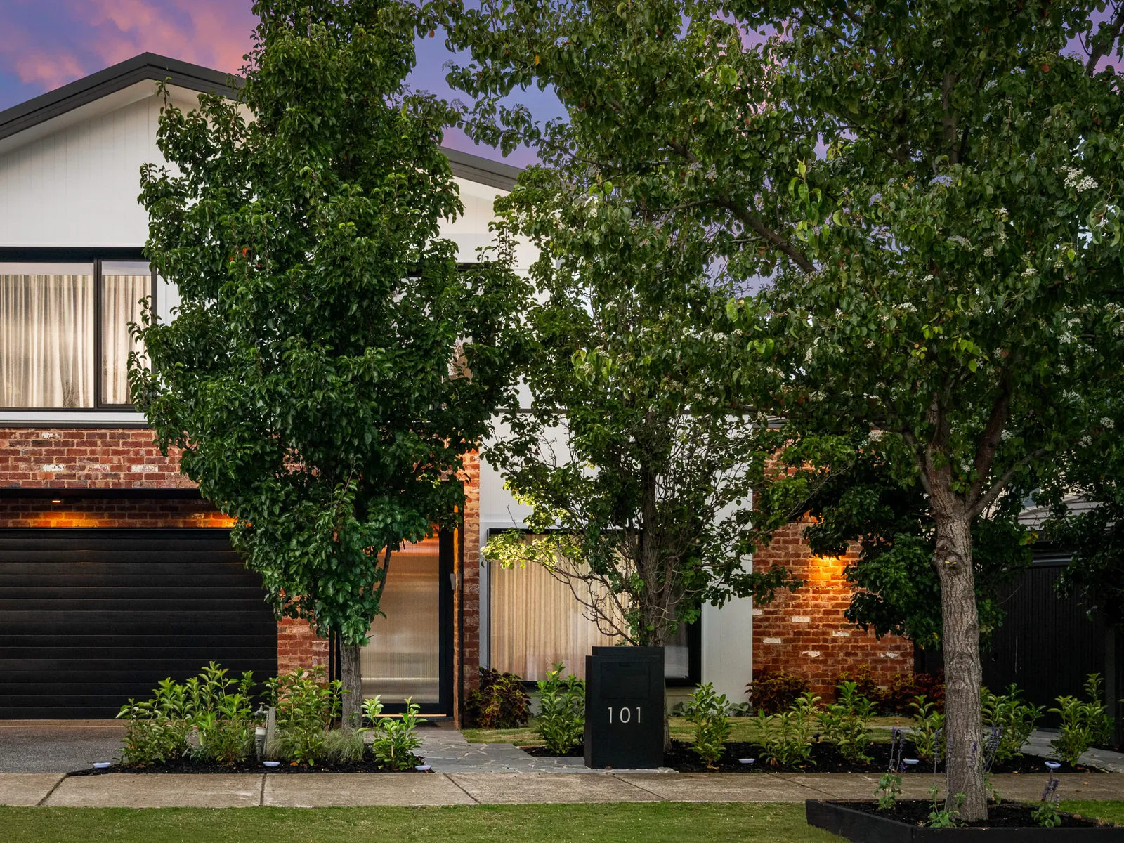 Twilight facade of a modern home on Rutledge Boulevard, North Geelong
