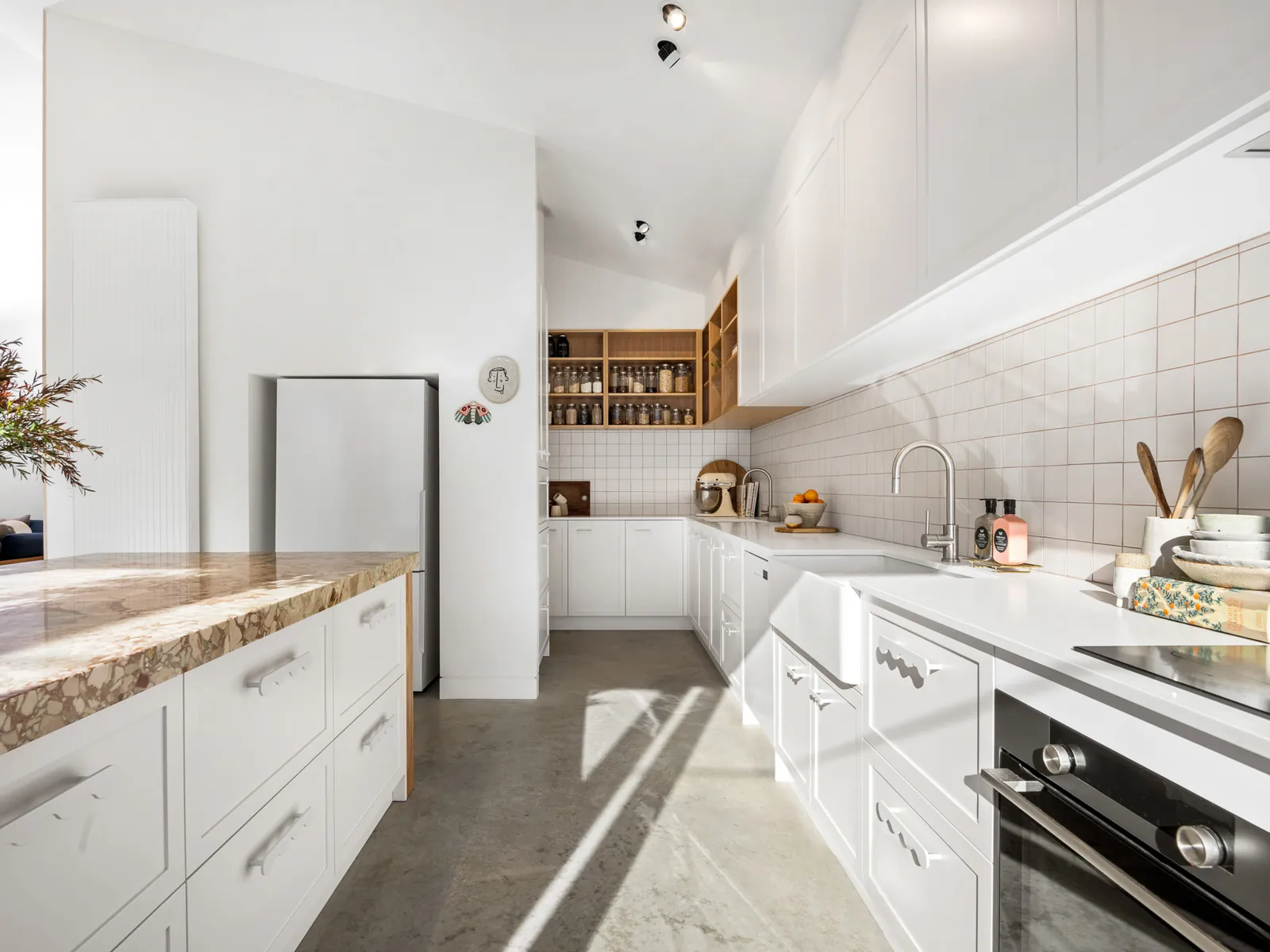 Sunlit white kitchen with square tile splashback, Avon Street, Geelong West