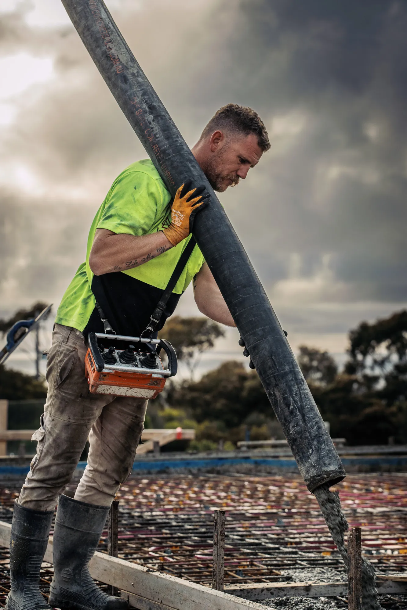 Concrete pump operator at work on a residential slab pour in Jan Juc
